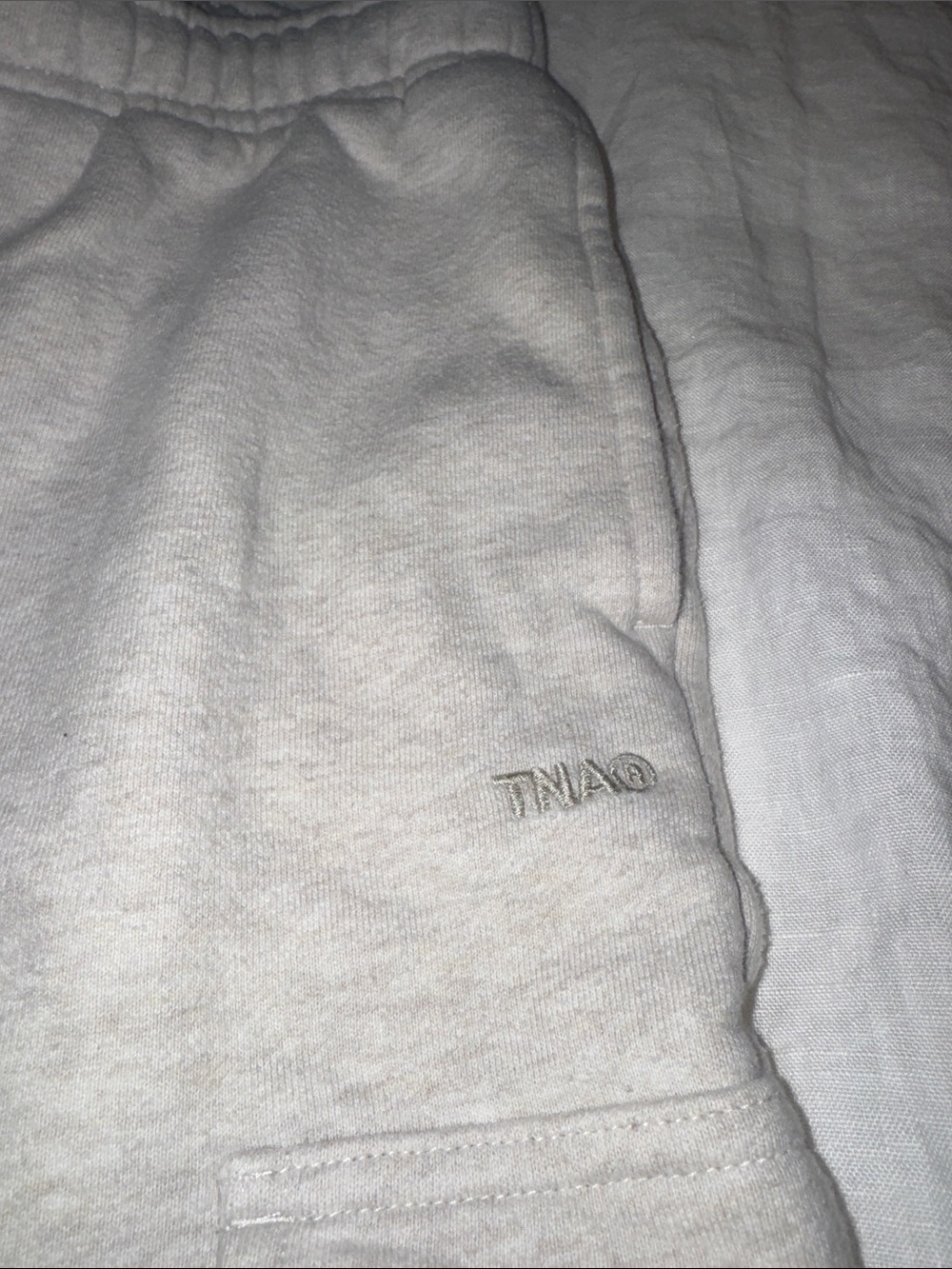 Aritzia TNA sweatfleece megafit Sweatpants in Light Cream w gray TNA logo